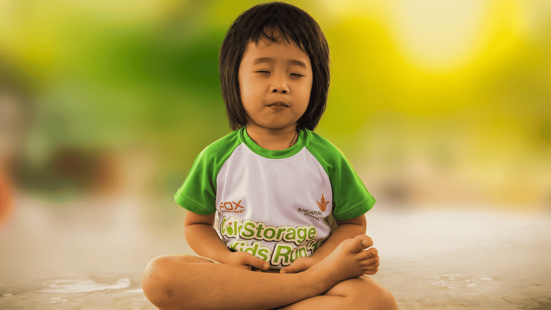 Child sat on floor meditating
